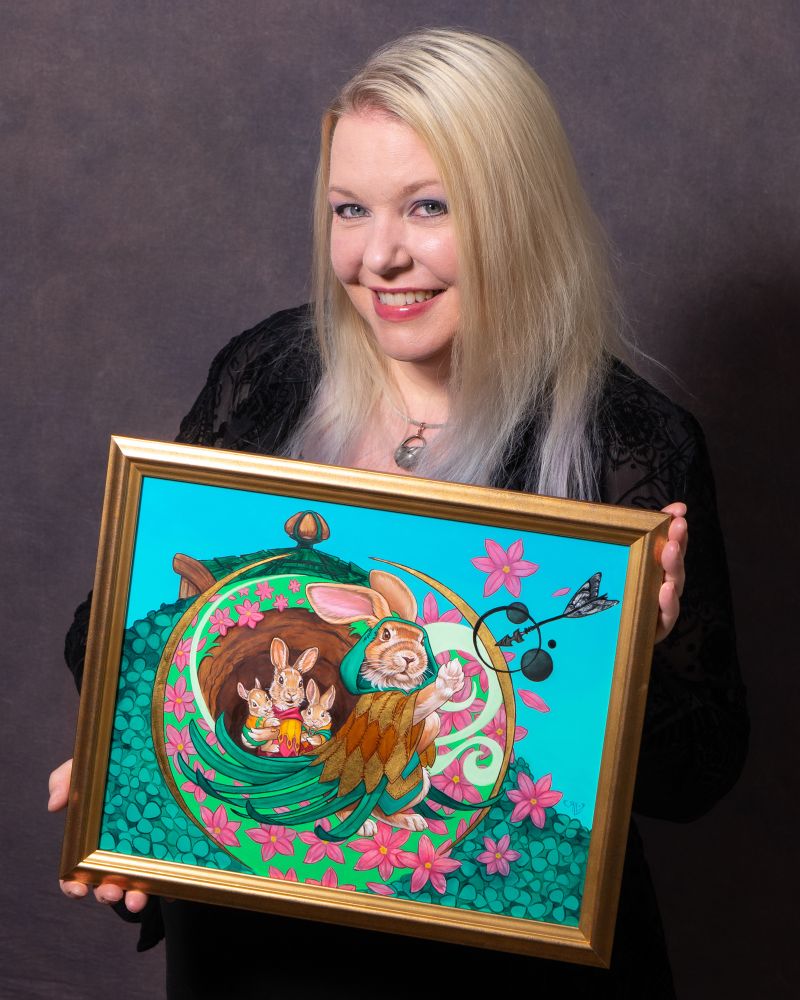 Me holding my painting