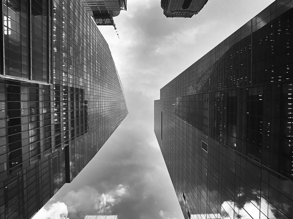 Two skyscrapers rise into the sky in Midtown Manhattan, Manhattan, New York.