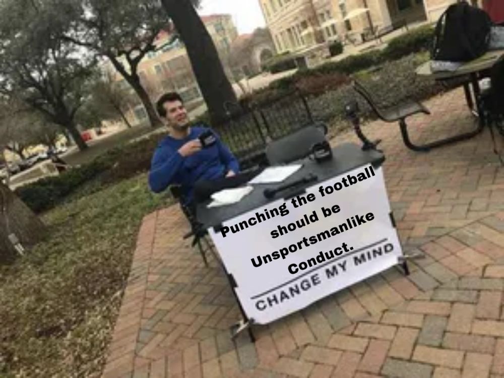 The "Change My Mind" meme which says "Punching the football should be Unsportsmanlike Conduct."