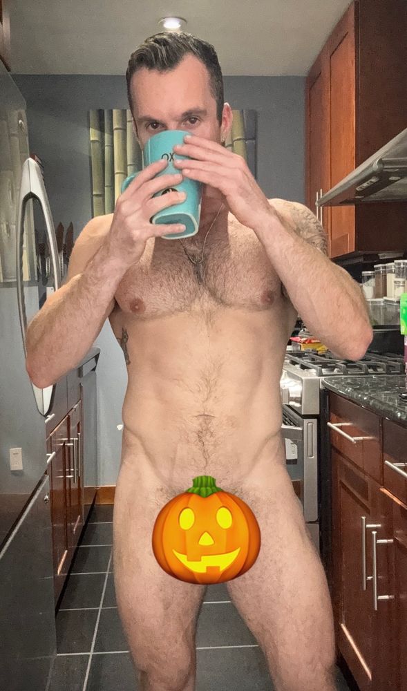 Same dumb make gay guy drinking coffee but a pumpkin emoji is covering his junk 