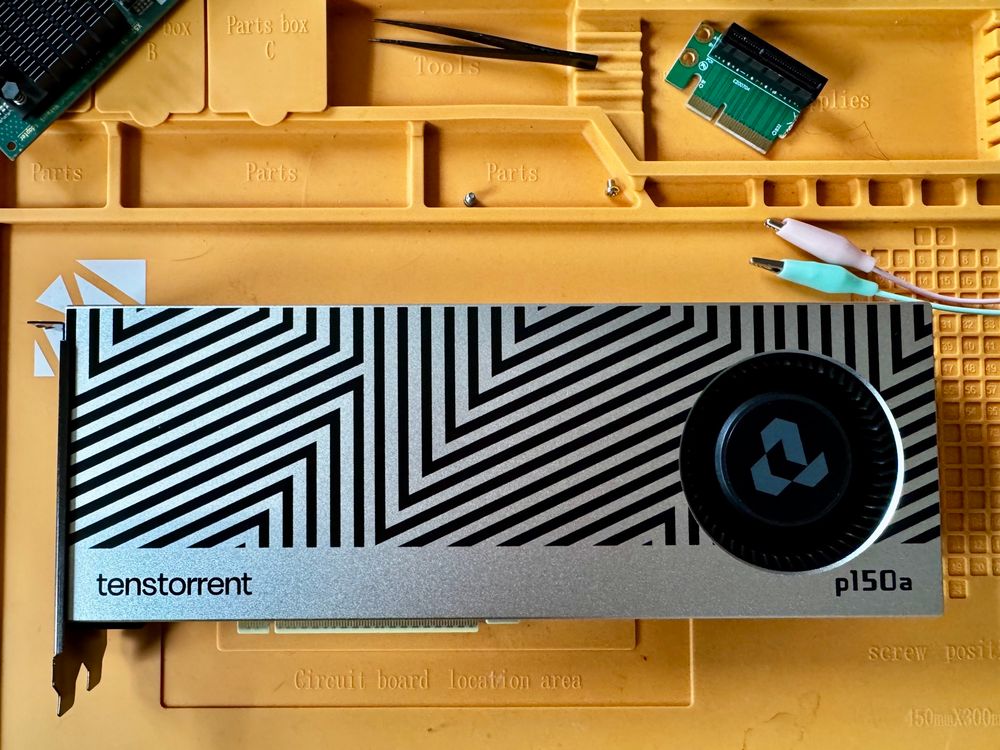 picture of Tenstorrent Blackhole accelerator card on my desk