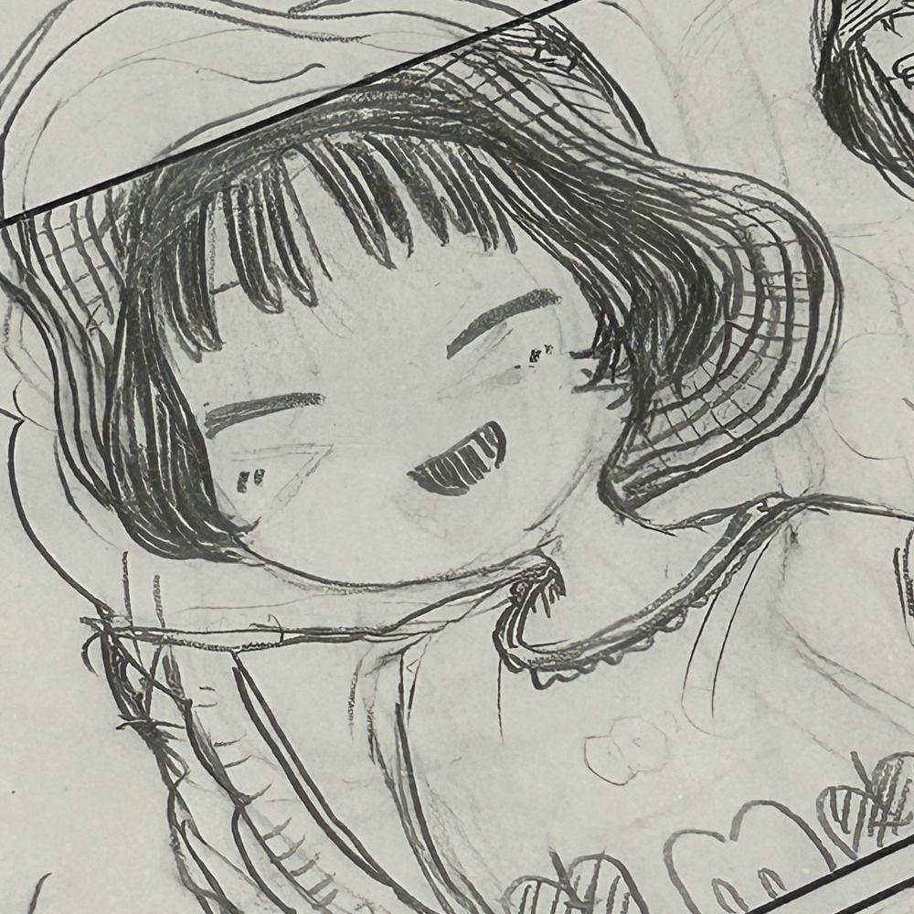 麦わら帽子を被った女の子が笑っている