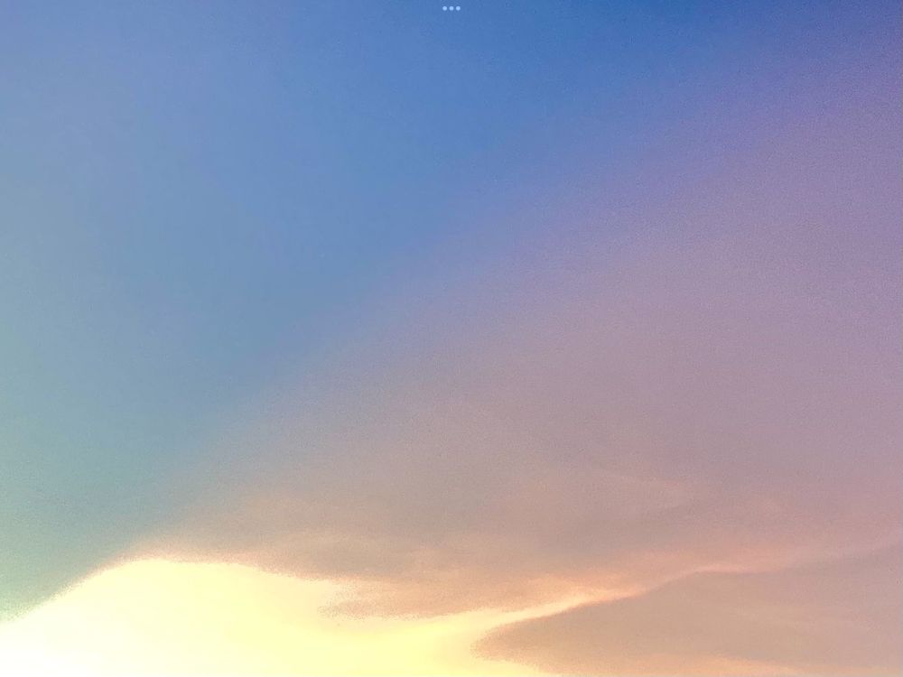 A sunset in pastel: soft blue, pink and yellow shades.