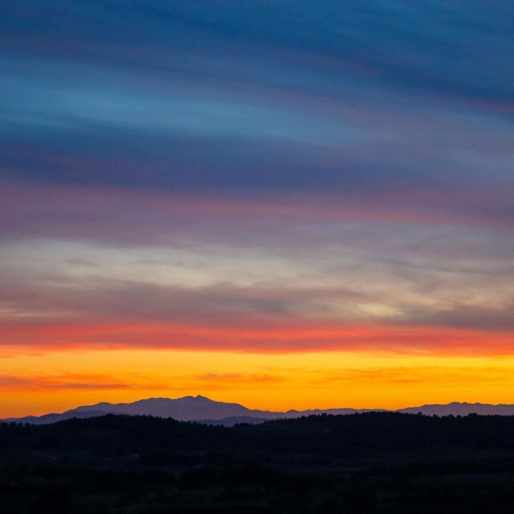Sunset over the Canigou, in the Eastern Pyrenees, from our roof terrace 57 miles / 91 km away. 