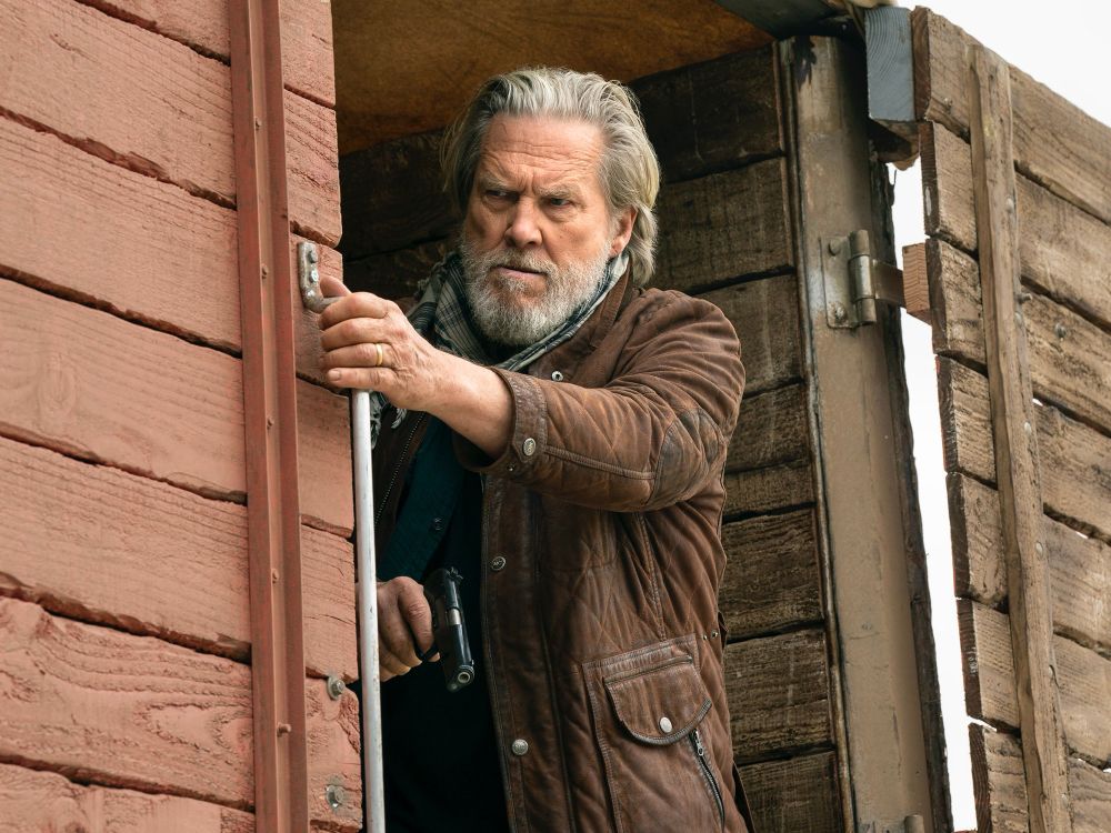 Jeff Bridges as Dan Chase, riding a train in season 2 of The Old Man