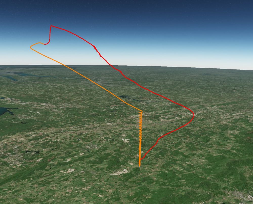 Flight path showing a balloon launch flying away, and then returning with an active recovery system (red on the way up, orange on the way down)