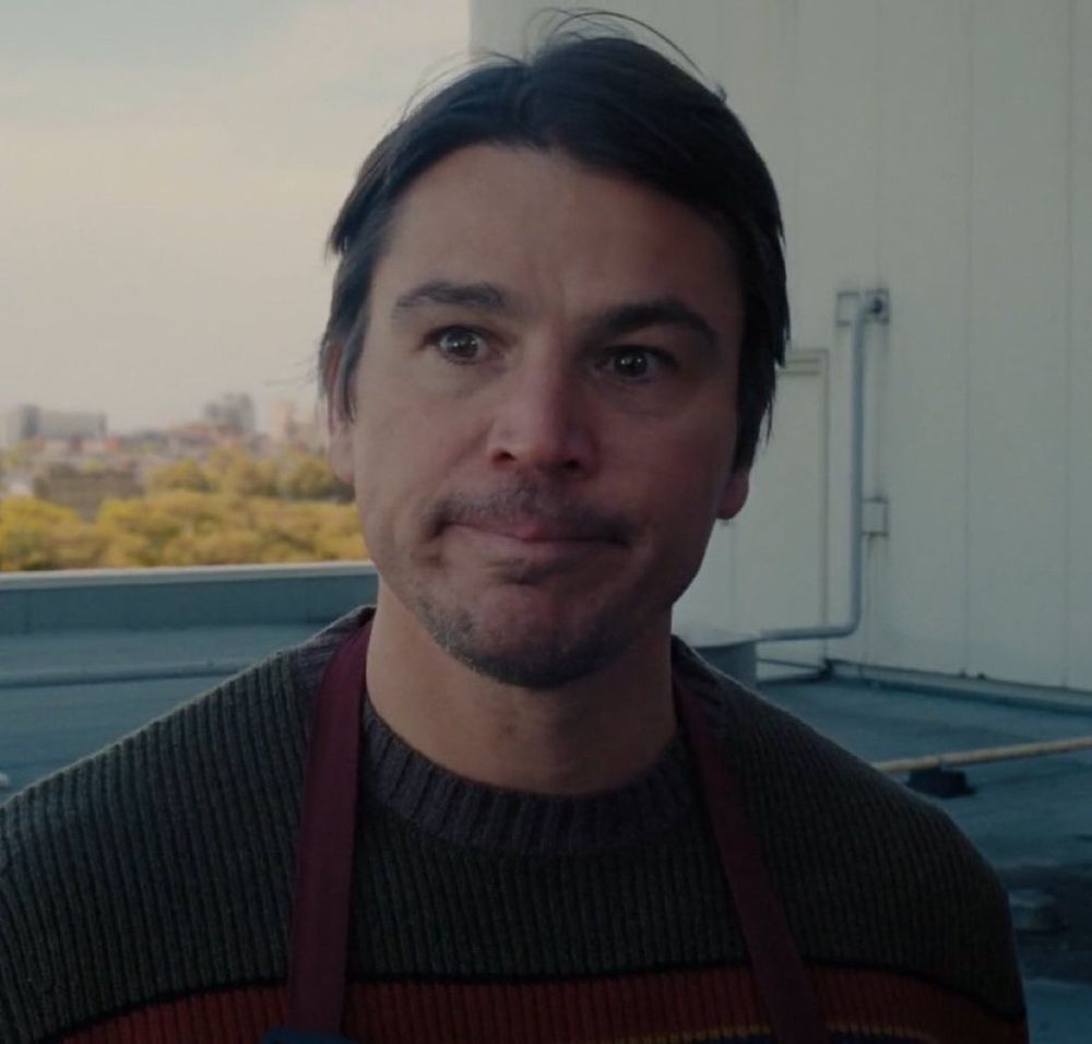 A screenshot of Josh Hartnett from the film Trap. He looks emotional. 