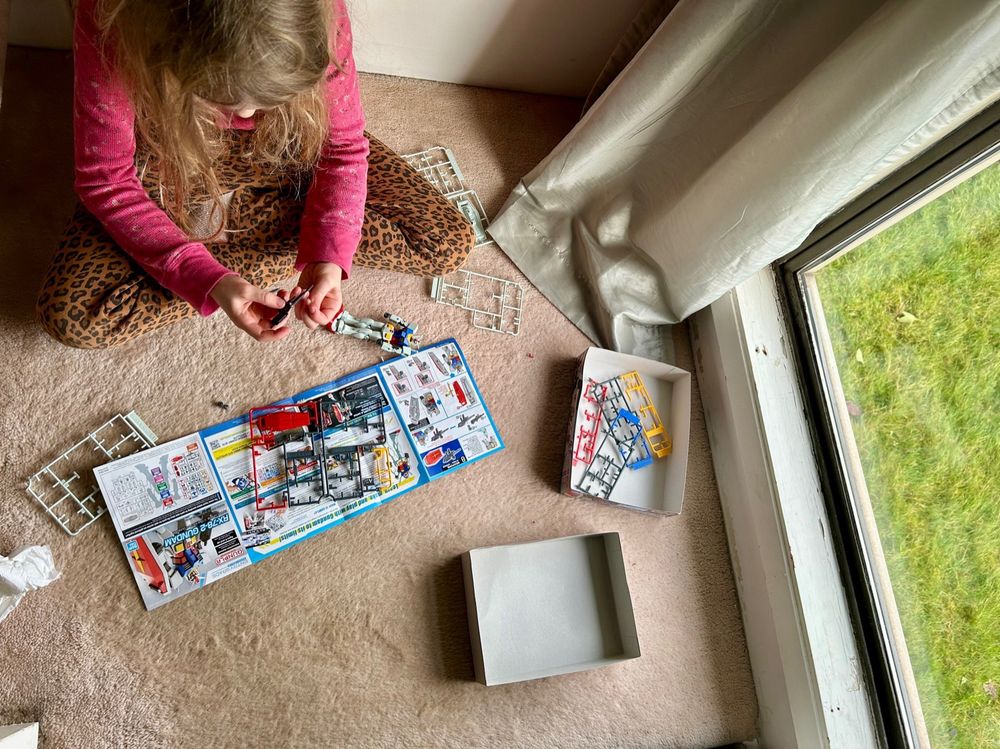 Child assembling an entry grad gundam 