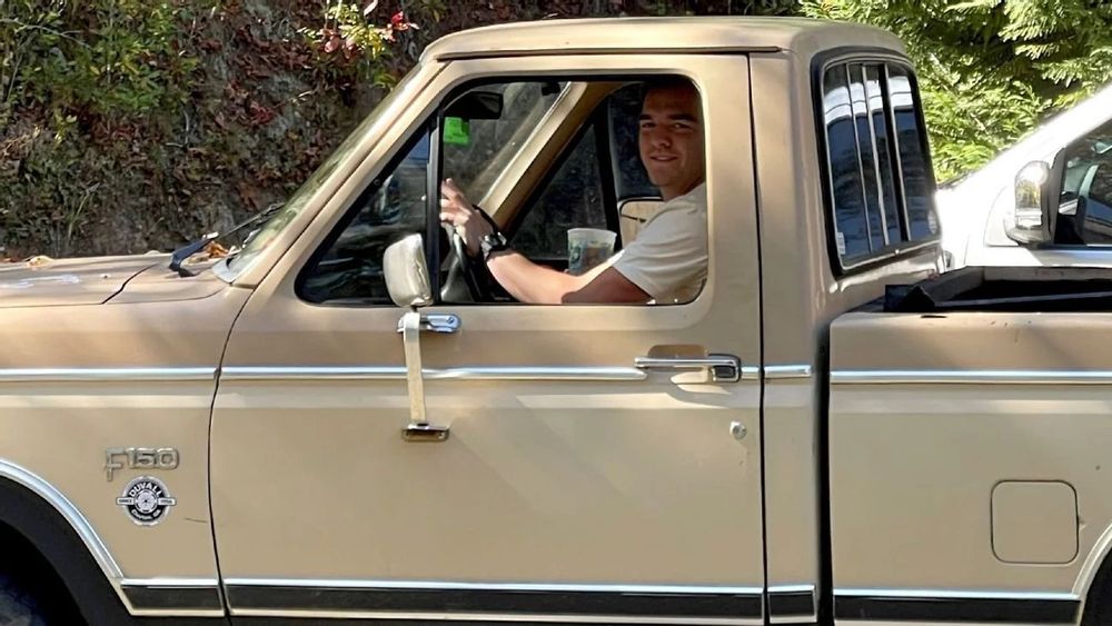 Designed-in-lab-specifically-for-UGA QB Gunner Stockton driving a beige 1984 F-150.