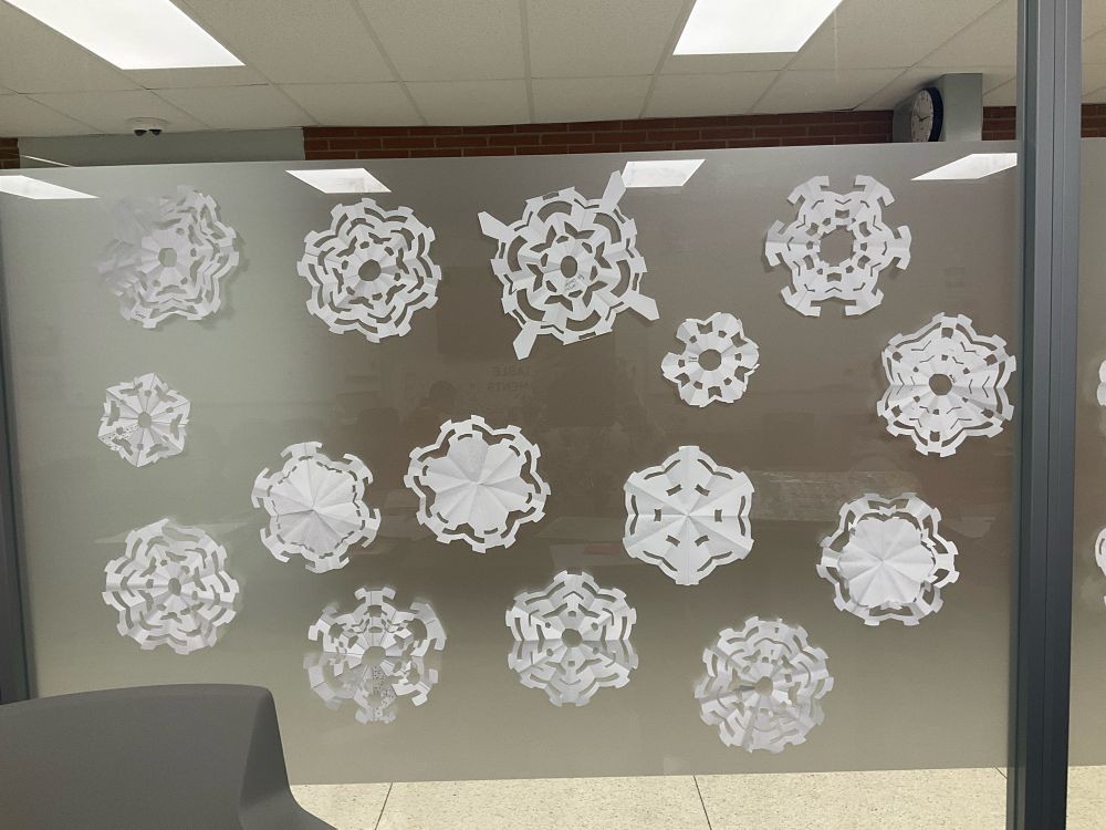 Paper snowflakes on a window