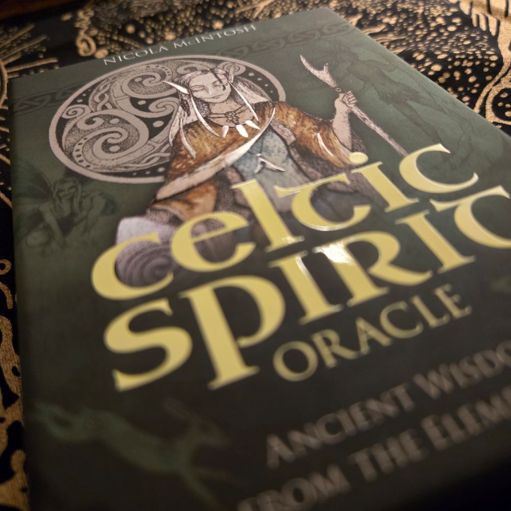 The cover of Celtic Spirit Oracle cards. With Celtic symbols and a goddess on a green background. 