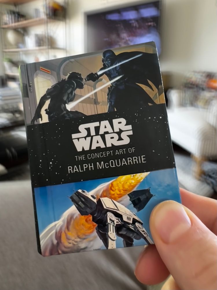 A mini-sized book of Star Wars Ralph McQuarrie concept art. 