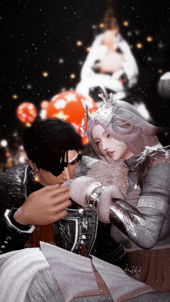 Guinevere is sitting on Zayn's lap in front of a giant christmas tree. She watches him with a longing gaze and a gentle smile while Zayn pulls her left hand to his lips to kiss.