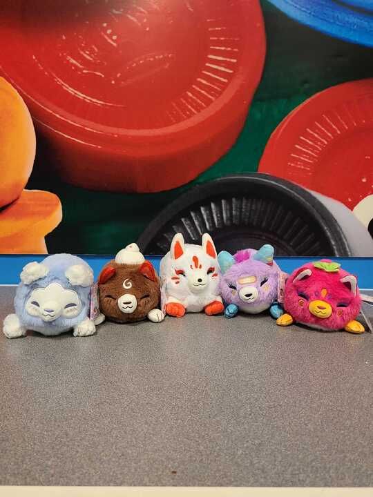 Squishable Kitsune Alter Egos, together on a gray table at the Games by James & Air Traffic combo store at Ridgedale Center:
Cloud, Cocoa, Normal, Decora, Fruity