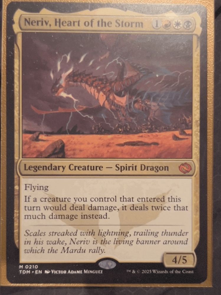 Neriv, Heart of the Storm
Legendary Creature - Spirit Dragon
Flying
If a creature you control that entered this turn would deal damage, it deals twice that much damage instead.
Scales streaked with lightning, trailing thunder in his wake, Neriv is the living banner around which the Mardu rally.
4/5
M 0210
TDM • EN I VICTOR ADAME MINGUEZ
IM & C 2025 Wizards of the Coast