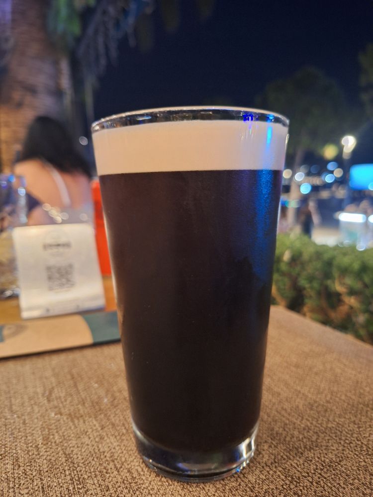 A pint of Guinness in a straight glass