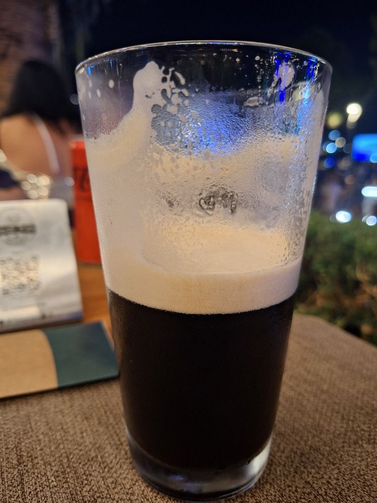 I half drunk pint of Guinness with good shtick coating the glass
