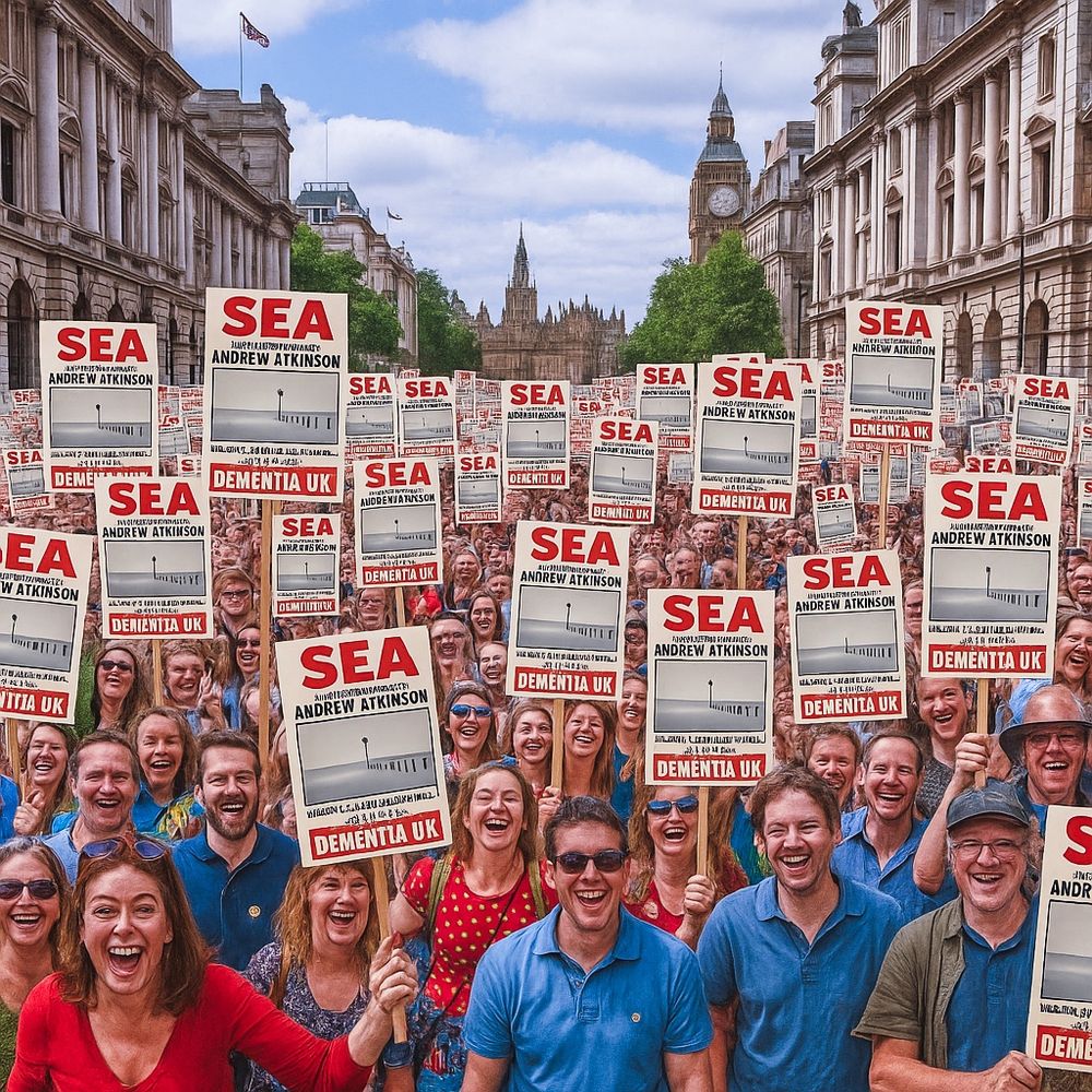 A huge group of people are celebrating the release of my photobook. They are holding up placards advertised by it