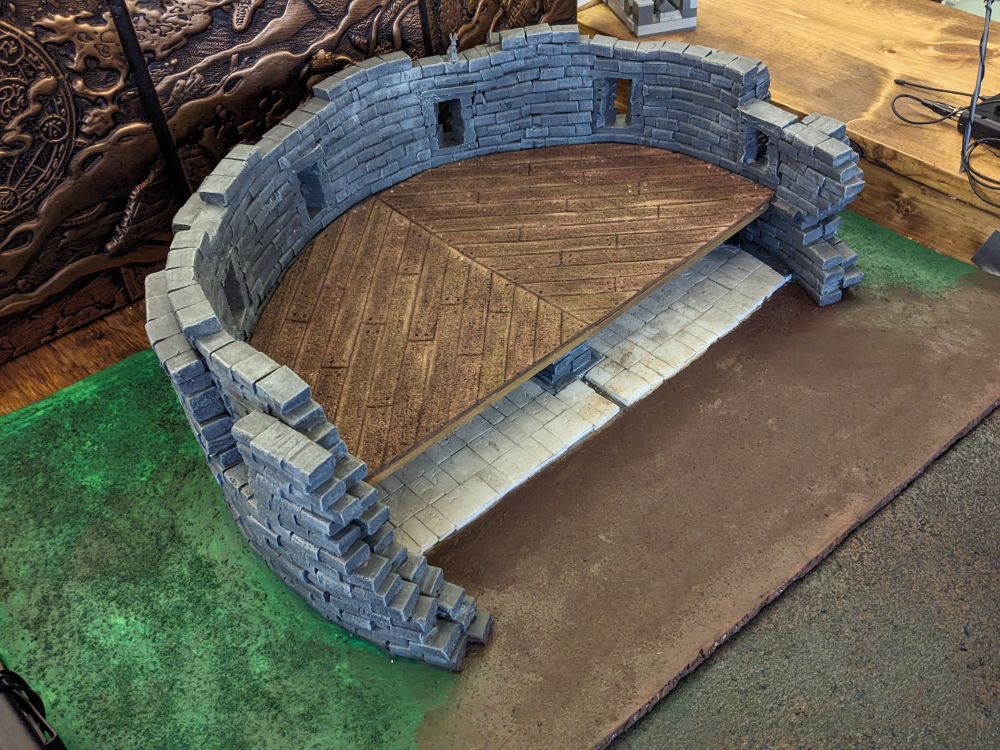 Overhead image of a two-story open-sided castle, with the second floor added and minis removed