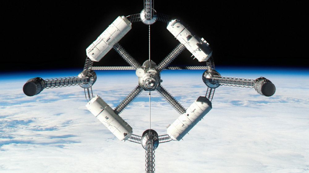 A spindly spacecraft with a big forward torus over Earth.