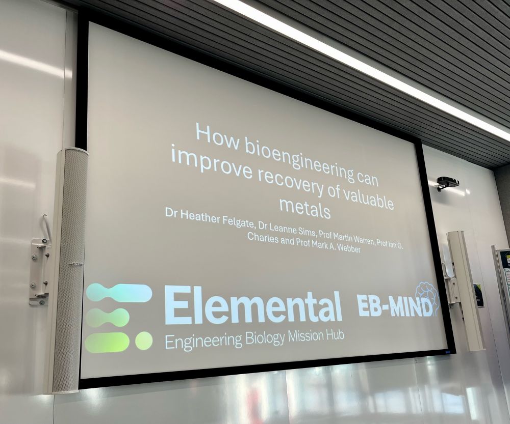 Introductory presentation slide with the title ‘How bioengineering can improve recovery of valuable metals’. The slide background is black with white text and logos.