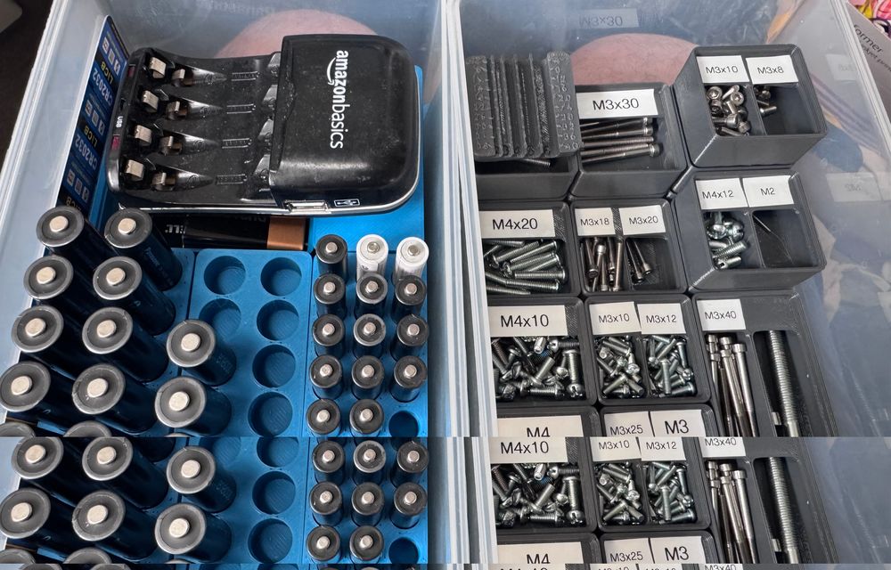 Two drawers filled with Gridfinity organiser bins for batteries and metric bolts