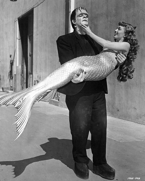 Glenn Strange as Frankenstein's monster, and Ann Blyth as a mermaid, on the Universal lot, 1948.