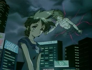 A picture from the 1994-1997 anime OVA series, "Key the Metal Idol". Key is in a city looking at the viewer while there is a puppet that looks like her coming out of an air portal. Some of the signs on the buildings in the city read "IUABLE" and "PIOMEER". There is also a logo on one of the buildings that looks like the Beats by Dre logo, predating it by over a decade.