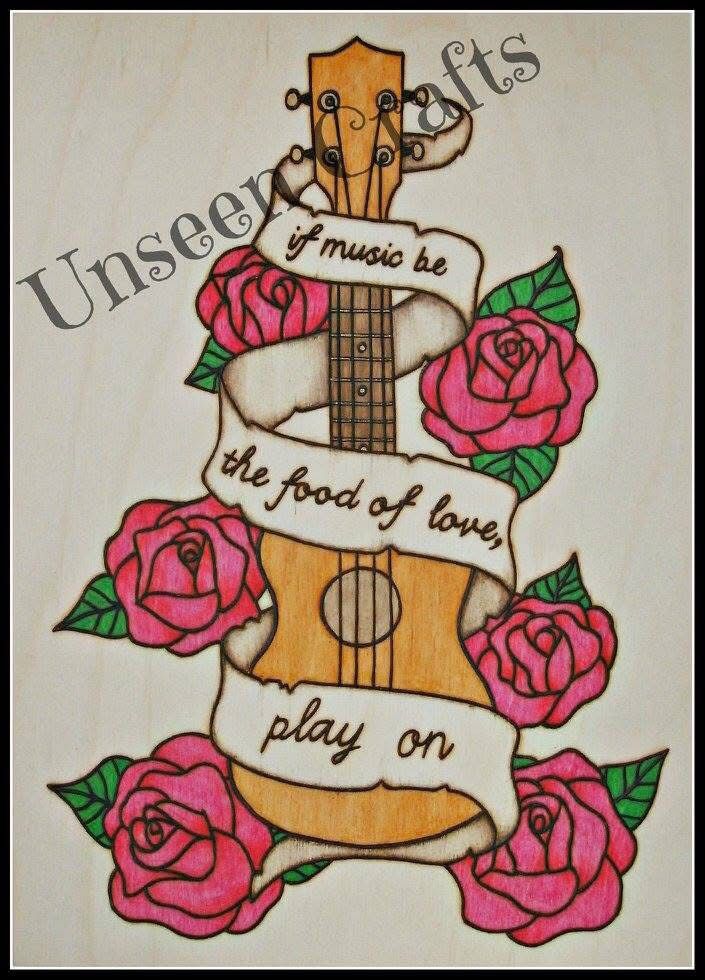 Rectangular wooden plaque with burned and painted design. Light wood ukulele with scroll going around it with the words “if music be the food of love, play on”. There are pink roses with green leaves around it.
