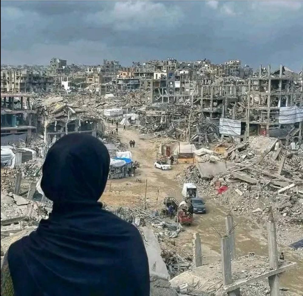 Tasneem in her destroyed city in Gaza.