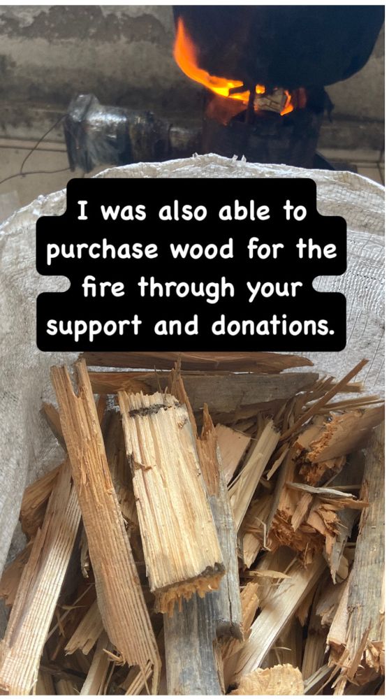 A photo of burning wood to cook food in Gaza with the words: "I was able to purchase wood for the fire through your support and donations."