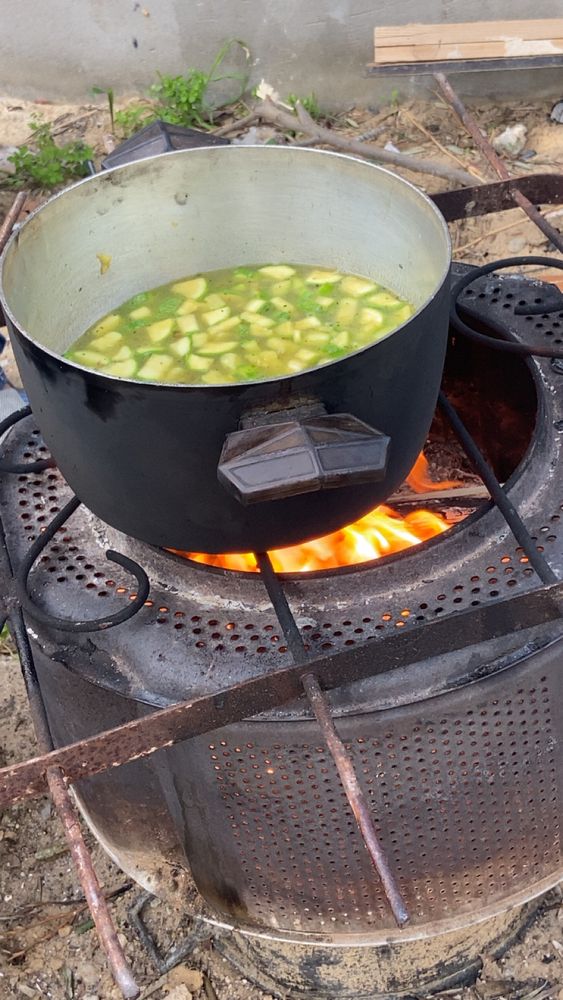Cooking over a makeshift fire.