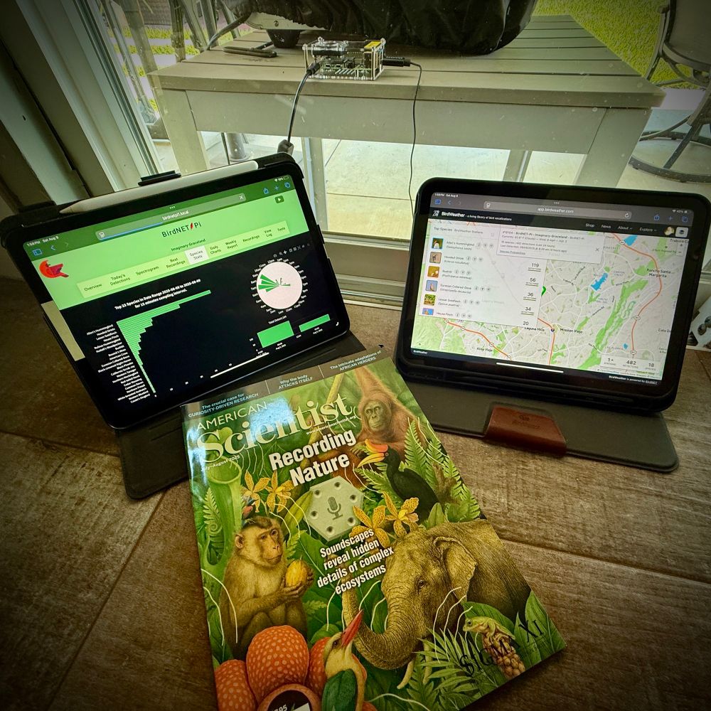 Clockwise from top… Nachtzuster / BirdNet-Pi running on Raspberry Pi 4 Model B 2019 Quad Core 64 Bit WiFi Bluetooth (4GB); Movo M1 USB Lavalier Lapel Clip-on Omnidirectional Computer Microphone (out of frame, on its own 20-foot cord); BirdWeather( https://www.birdweather.com ) on iPad 10; American Scientist July-August 2025 issue; BirdNET-Pi on iPad Air 5 ( https://www.birdweather.com/birdnetpi )
