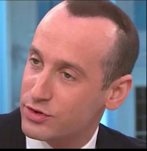 Stephen Miller with sprayed on widow’s peak hair