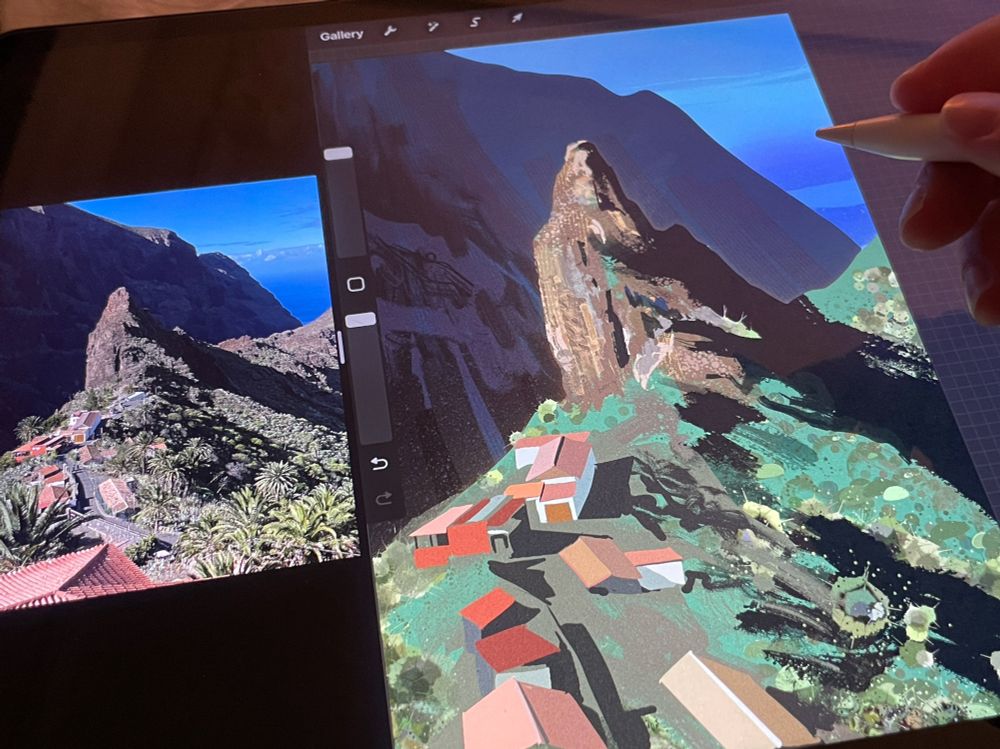 painting of little mountain and some houses on an ipad