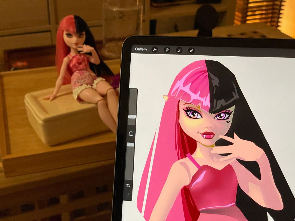 ipad sketch of a doll posed on a table