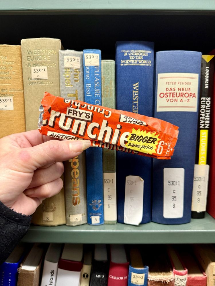 Old chocolate bar wrapper and some books 