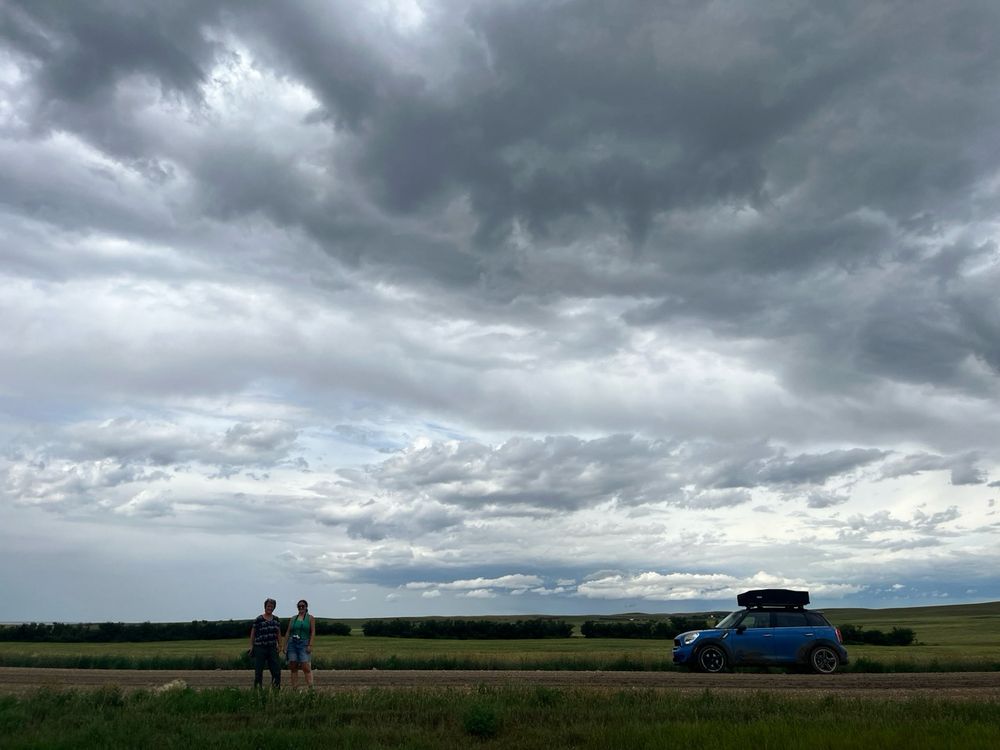 Our car at Grasslands National Park - we came back for a second visit as it was so stunning. Thunderstorms rolled in.