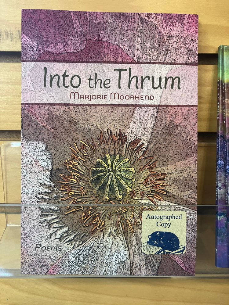 Closeup of book on display. Autographed copy section. Into the Thrum poems by Marjorie Moorhead. 