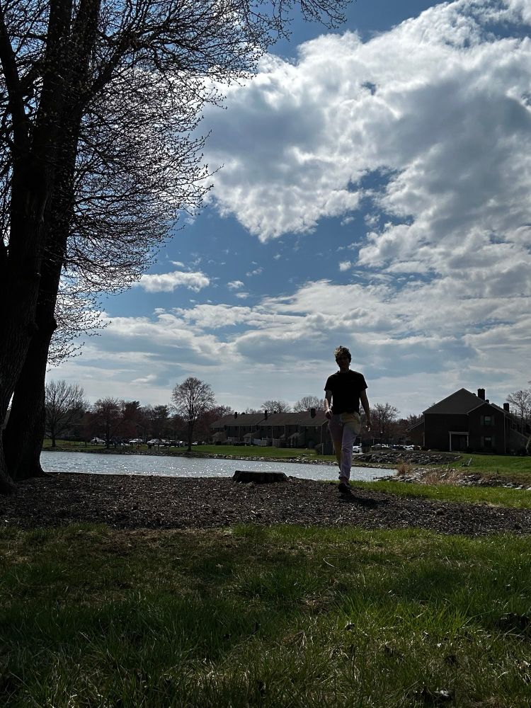 chase walking by our little lake 