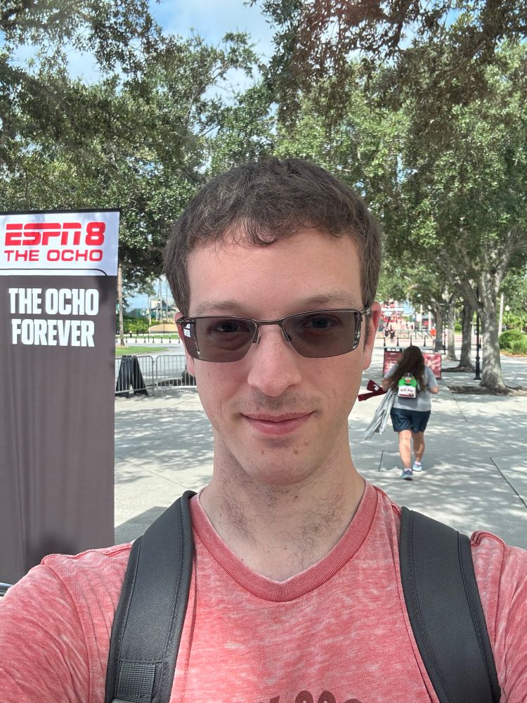 A selfie in front of the ESPN8 The Ocho sign 