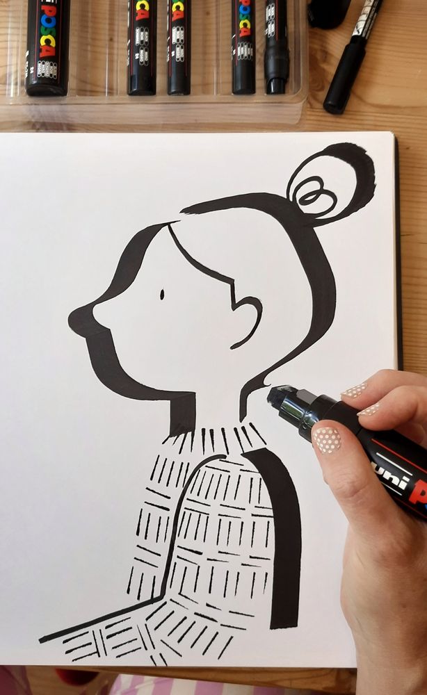 Black and white drawing of a woman's head in profile, drawn with a thick black marker.