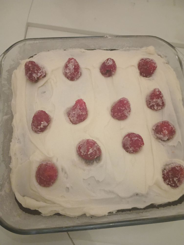 Devil's food boxes cake mix (coffee added for flavor), canned vanilla frosting and sugared fresh raspberries in a square pyrex dish.