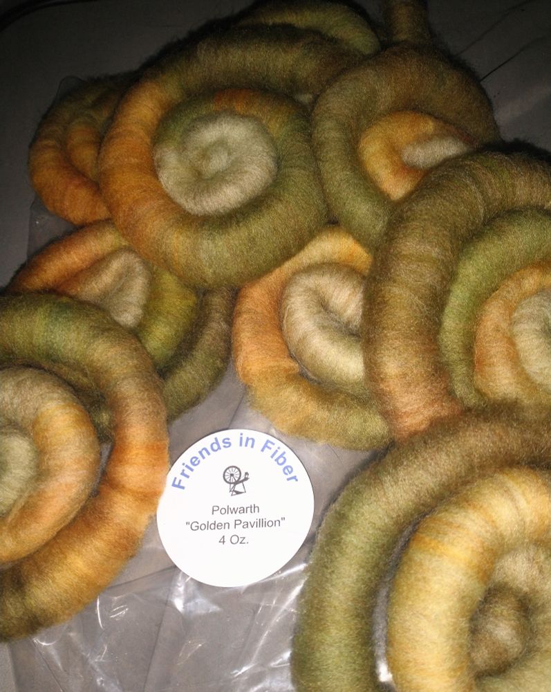 Rolags in greens and golds from Friends in Fiber. It is 4 ounces of Polwarth in the colorway "Golden Pavilion"