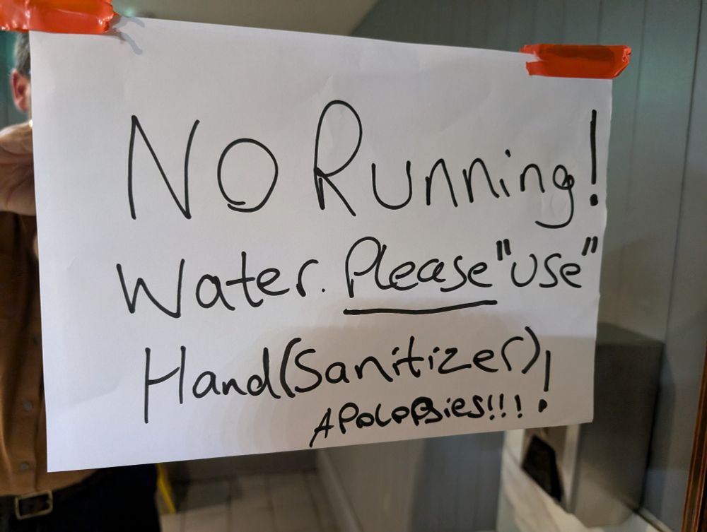 Handwritten sign. It reads: 
No Running! 
Water _Please_ "use" 
Hand (Sanitizer)
APOLOPJIES