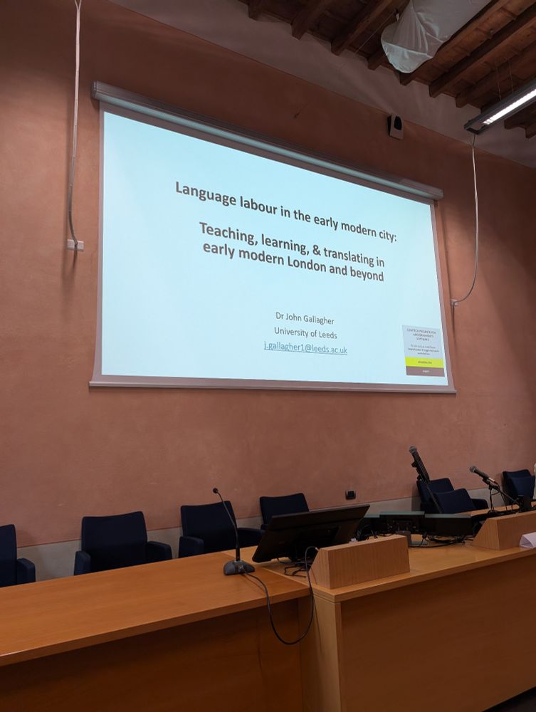 The same big screen with the title of my talk. Language labour in the multilingual city: teaching, learning, & translating in early modern London and beyond. 