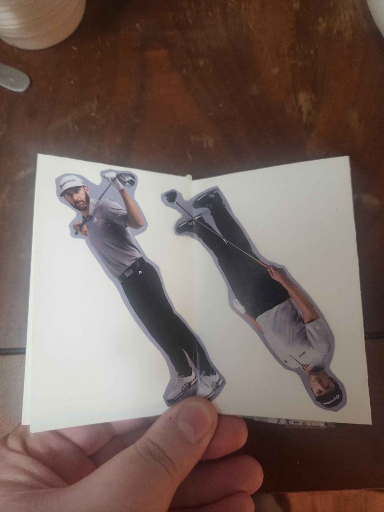 Two cutouts of golfers, one is upside down