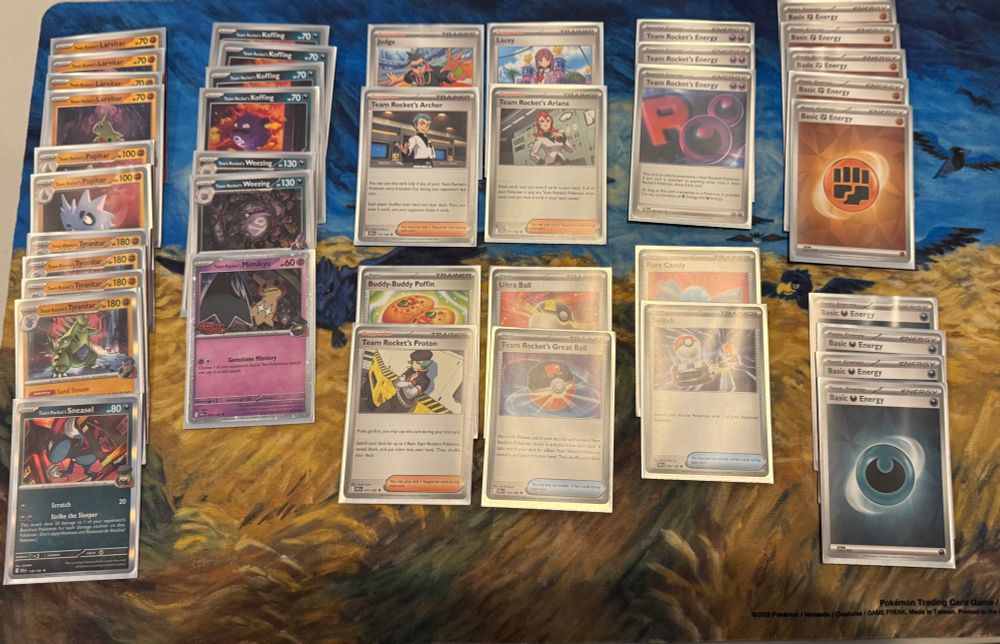 A Fighting and Darkness deck built around Team Rocket’s Tyranitar and Team Rocket’s Weezing