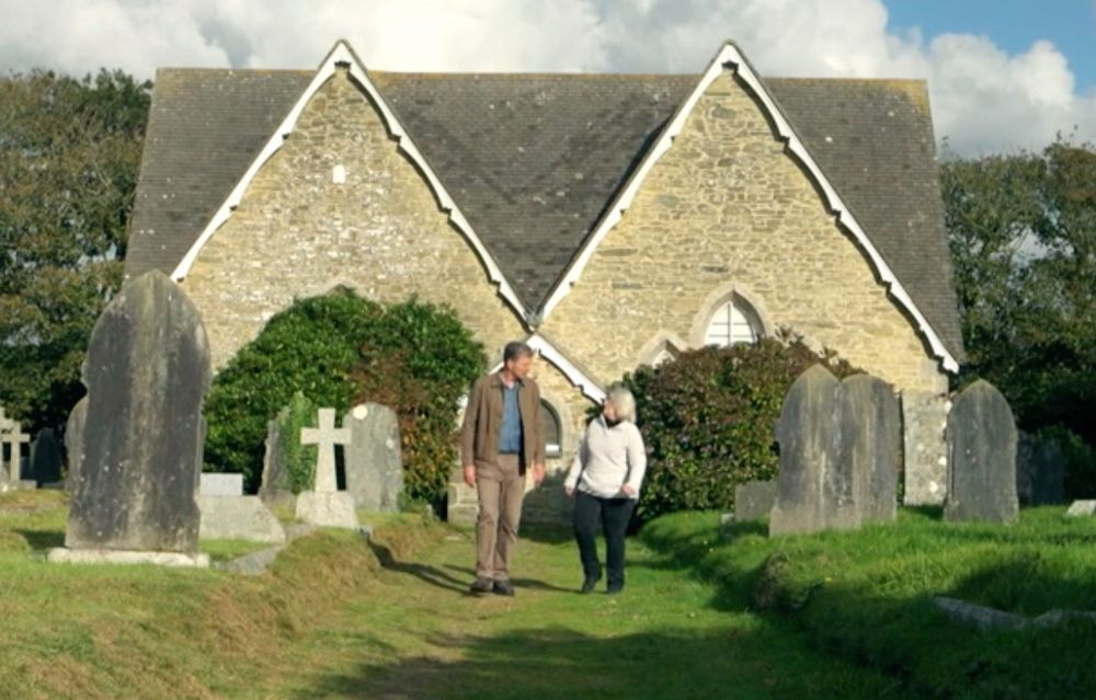Lesley walking through graveyard with Ben Showing huge difference in height.