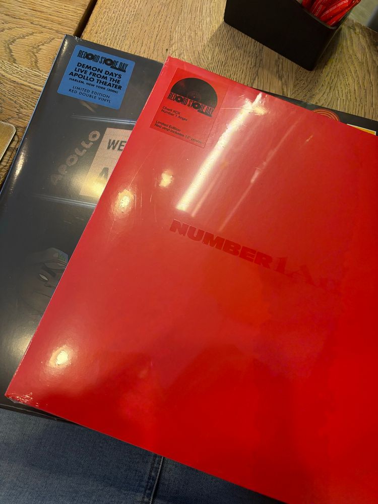 Two vinyls purchased at Record Store Day promotion. First album is Red and the title Number 1 Angel is in the centre. The second album is obscured, but it is Demon Days live at the Apollo from 2006. 